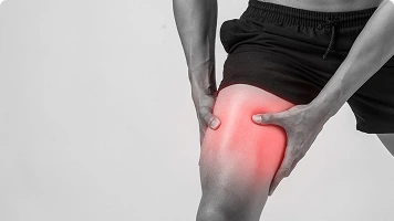 Man holding elbow in pain