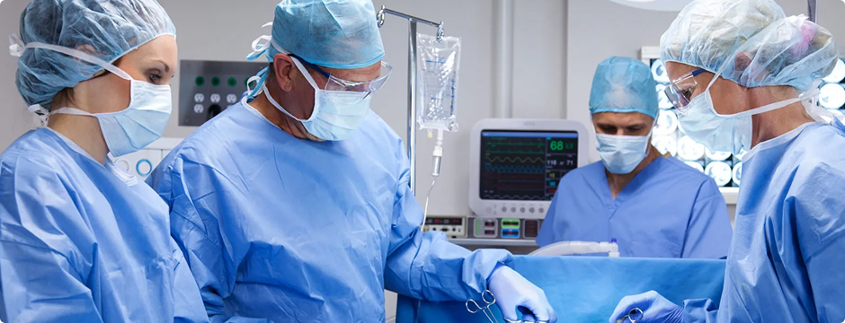 Alt txt: Endocrinologist performing thyroid surgery in operating room